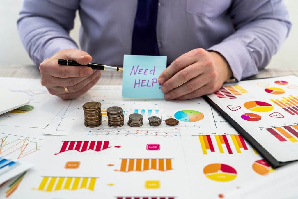 Businessman working analyzing company profits using charts documents using coins business analysis strategy concept | Interpreters, costs